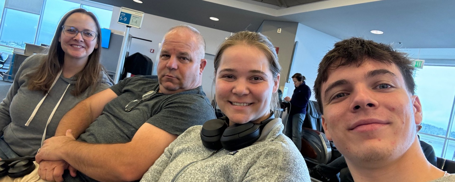 family selfie in airport