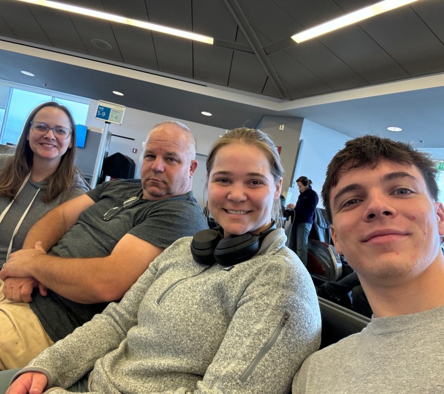 family selfie in airport